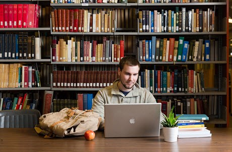 Student in The University of Winnipeg's library Student in The University of Winnipeg's library